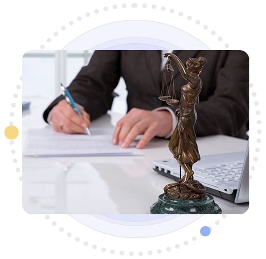 A person sitting at a desk with a laptop